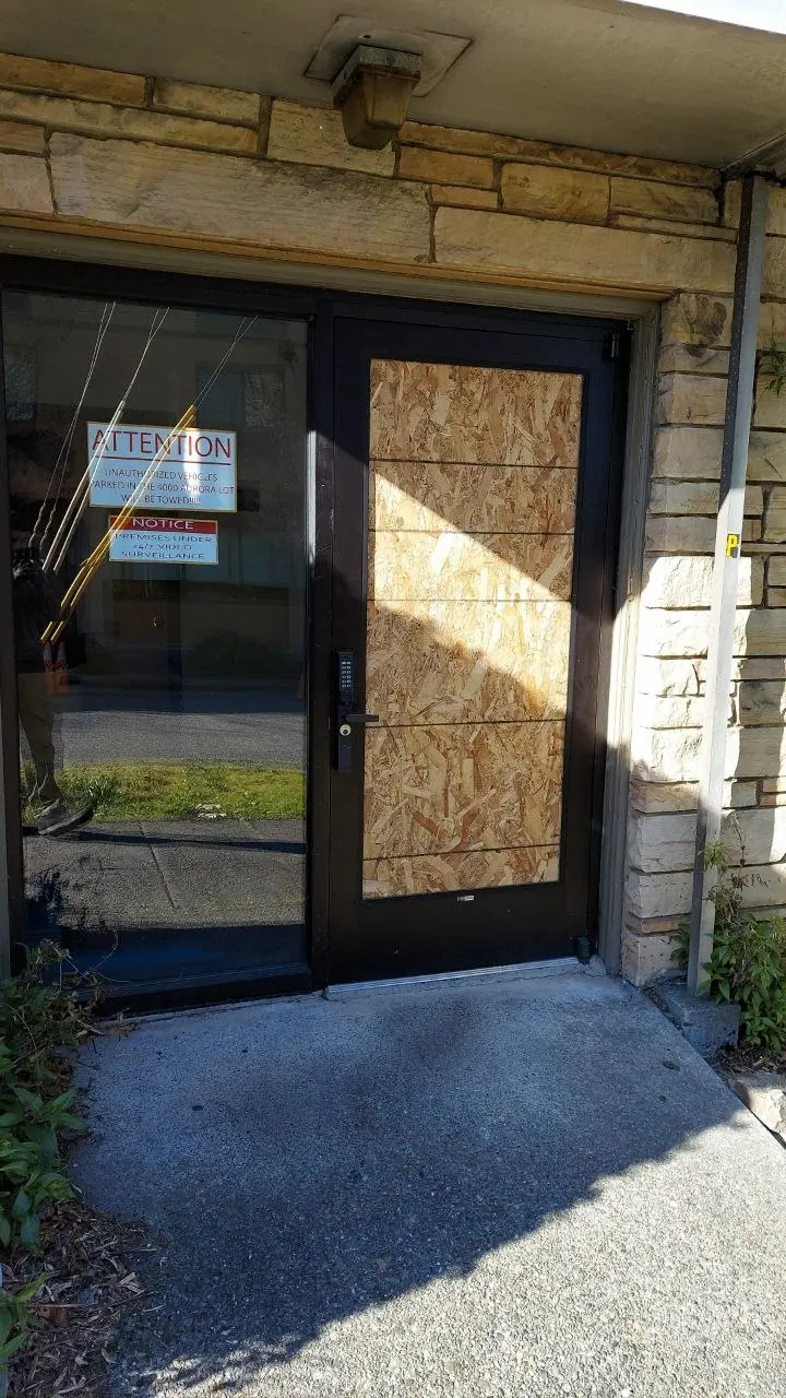 Commercial door with metal and glass